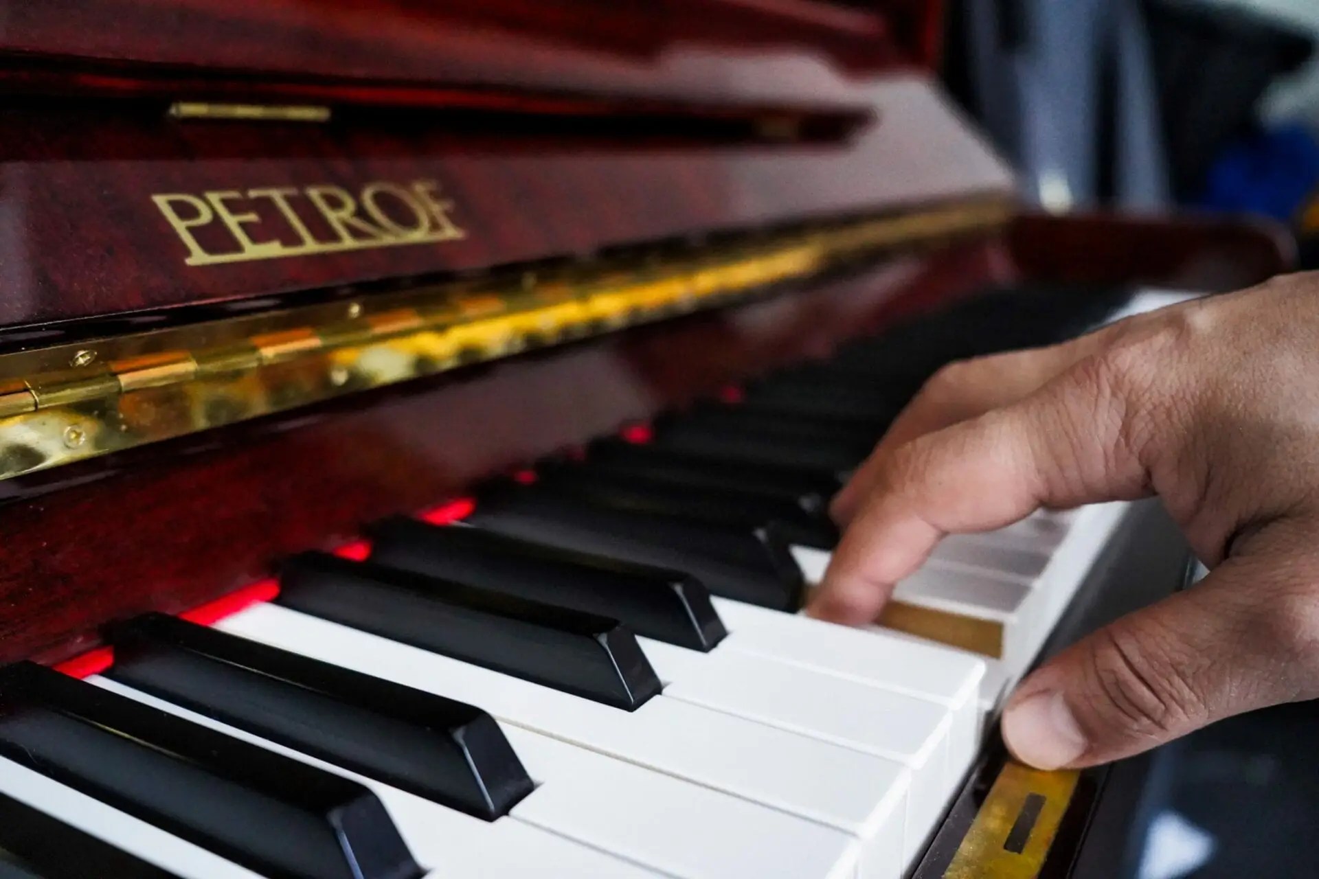 Piano with hand